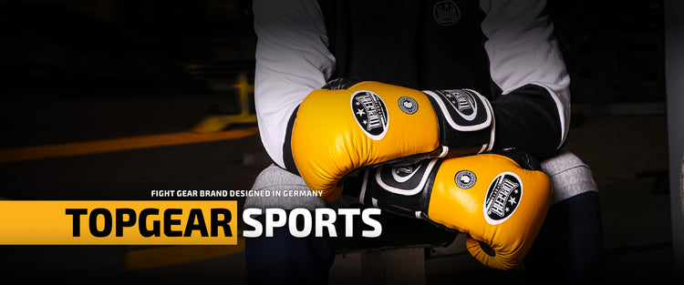 Close-up of yellow Topgear Sports boxing gloves used in professional training